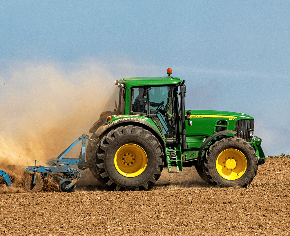 John Deere Tractor in a harvested field